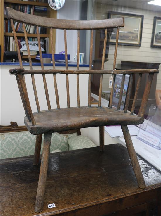 An elm comb and stick back open arm elbow chair